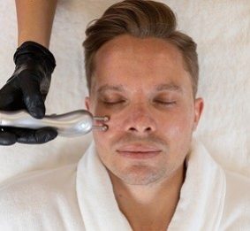 Facial Treatment with Microcurrent done on a man